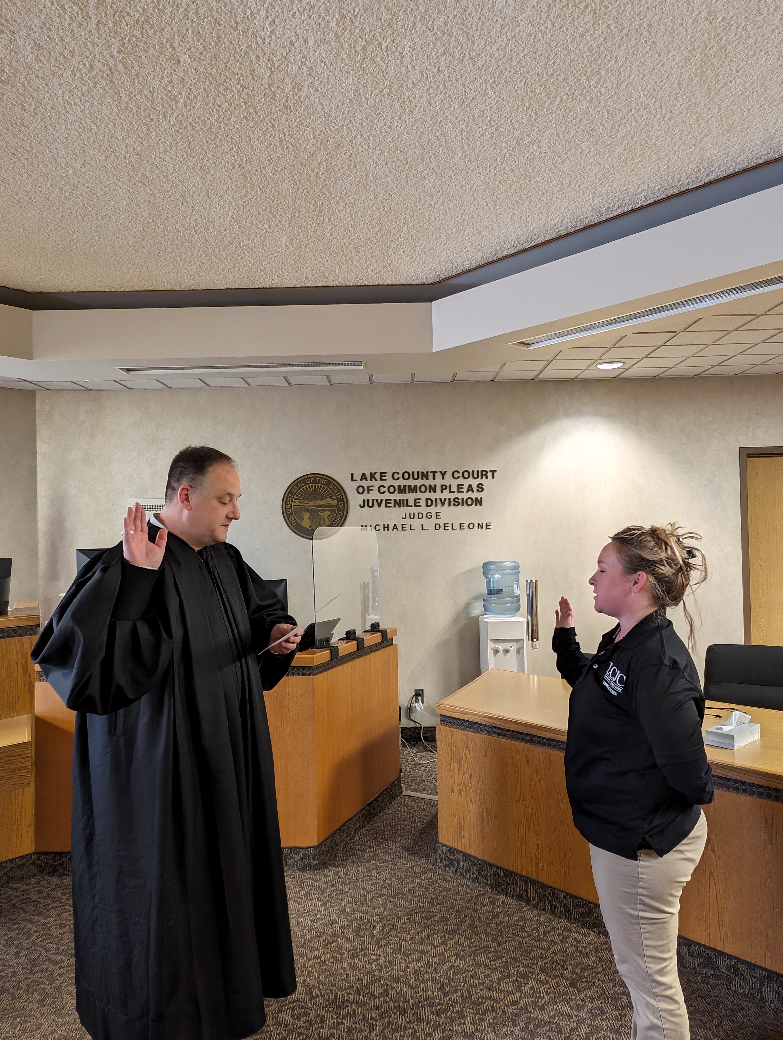 Judge DeLeone swearing in Carla Ricket as a Juvenile Corrections Officer
