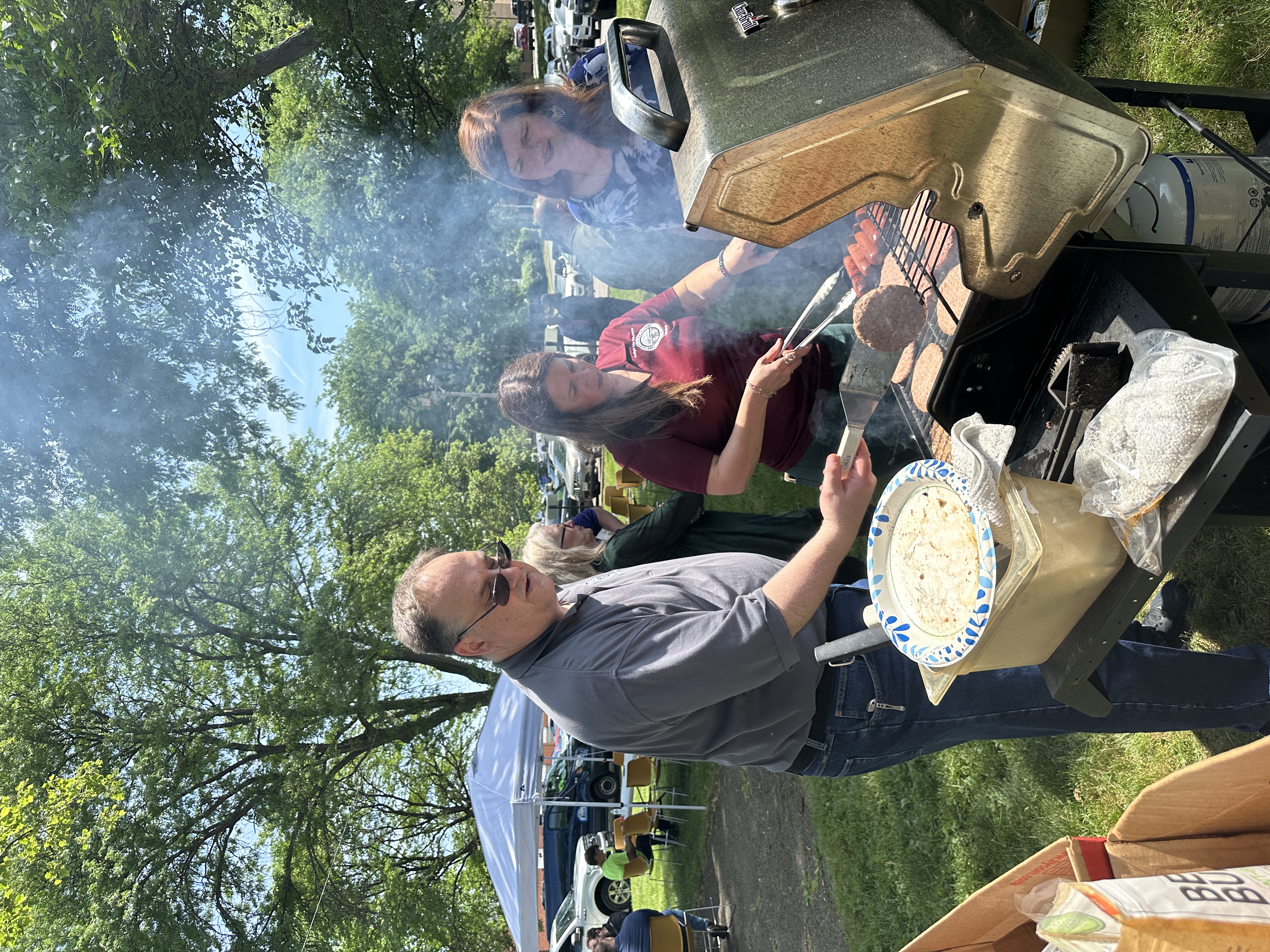 Judge DeLeone working the grill for the Juvenile Court's Memorial Day Cookout