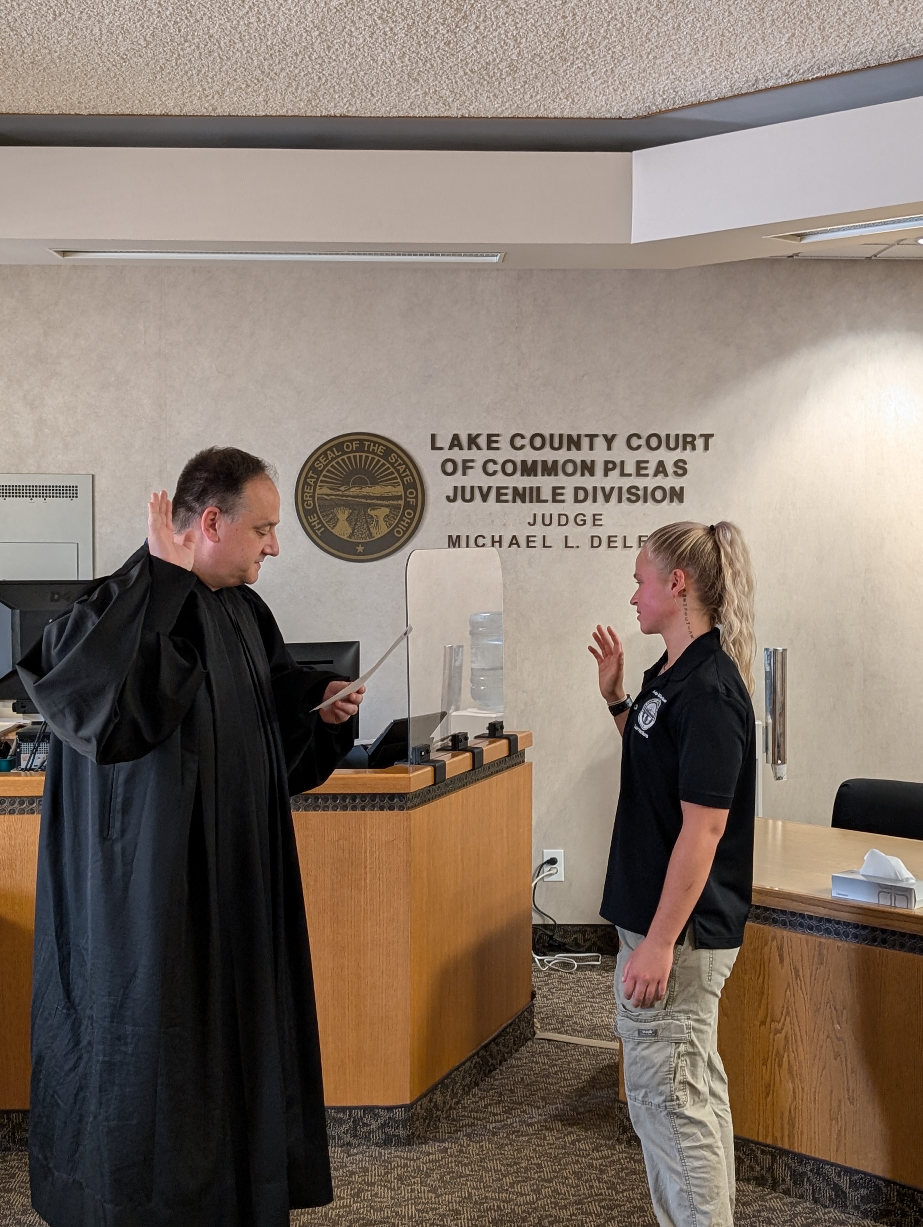 Judge DeLeone swearing in Anna Horen as a Juvenile Corrections Officer.