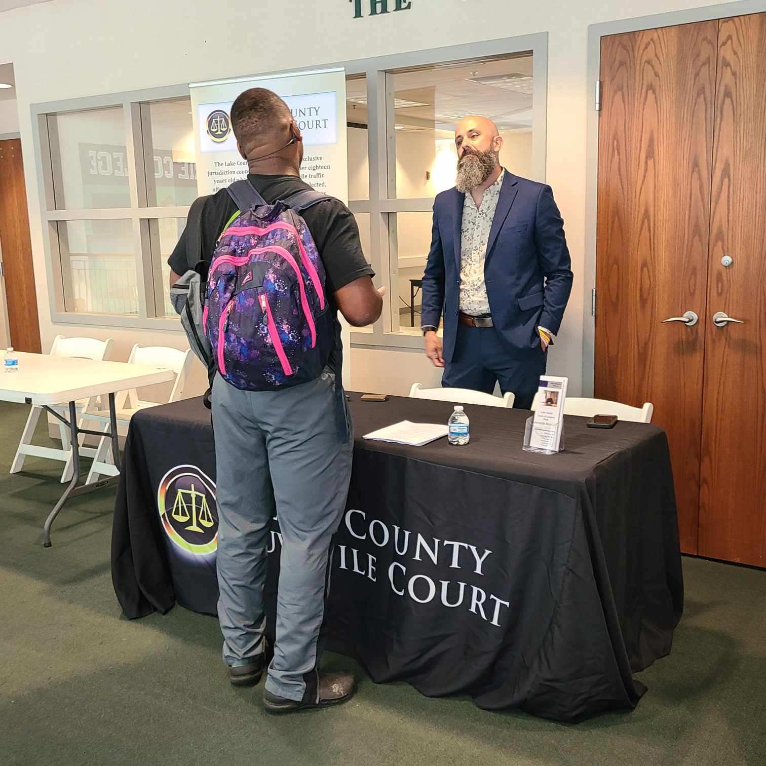 John Zinnicker speaking with Student at Lake Erie College Career Fair