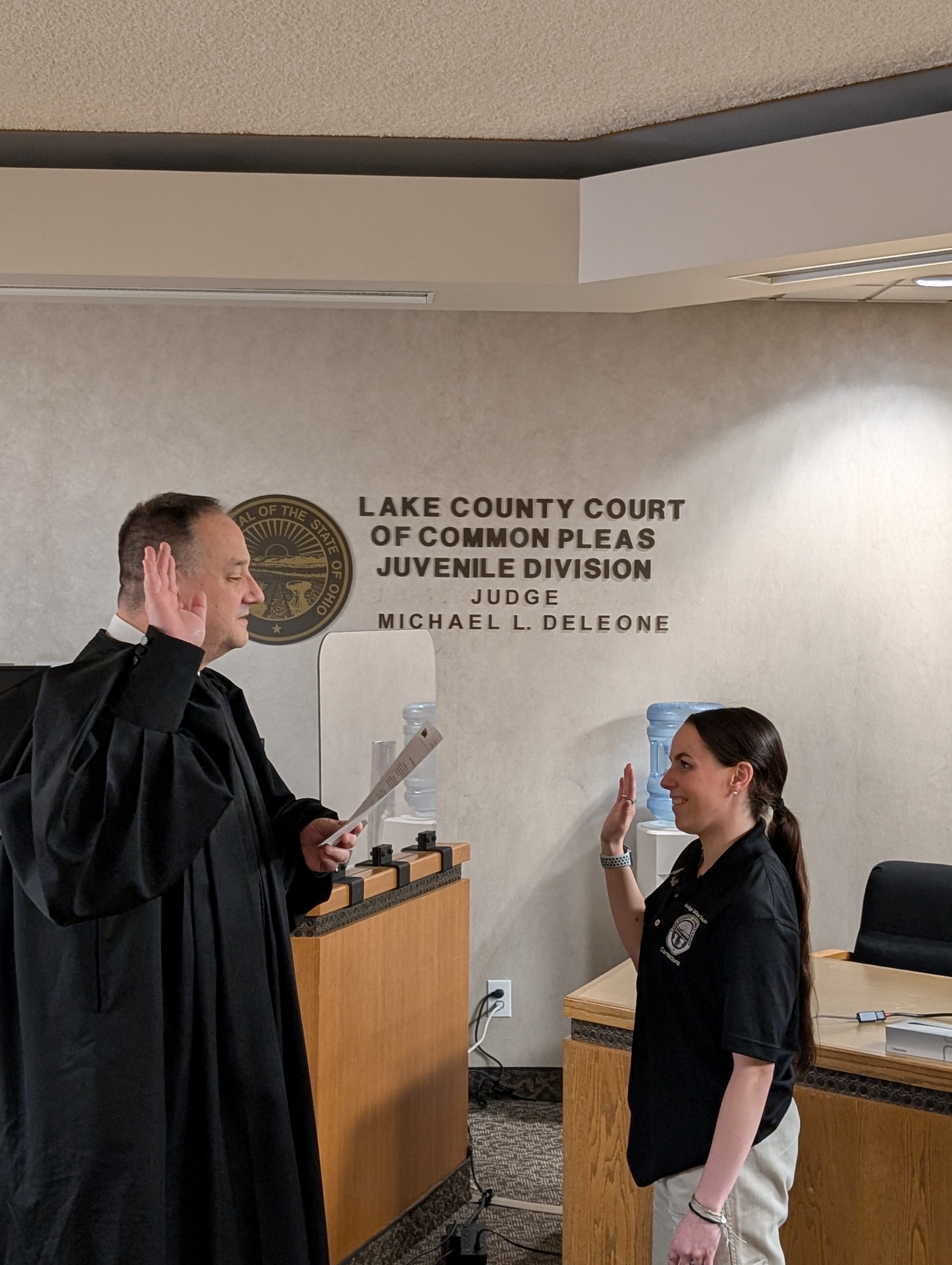 Judge DeLeone swearing in Kayla Manna as a Juvenile Corrections Officer.