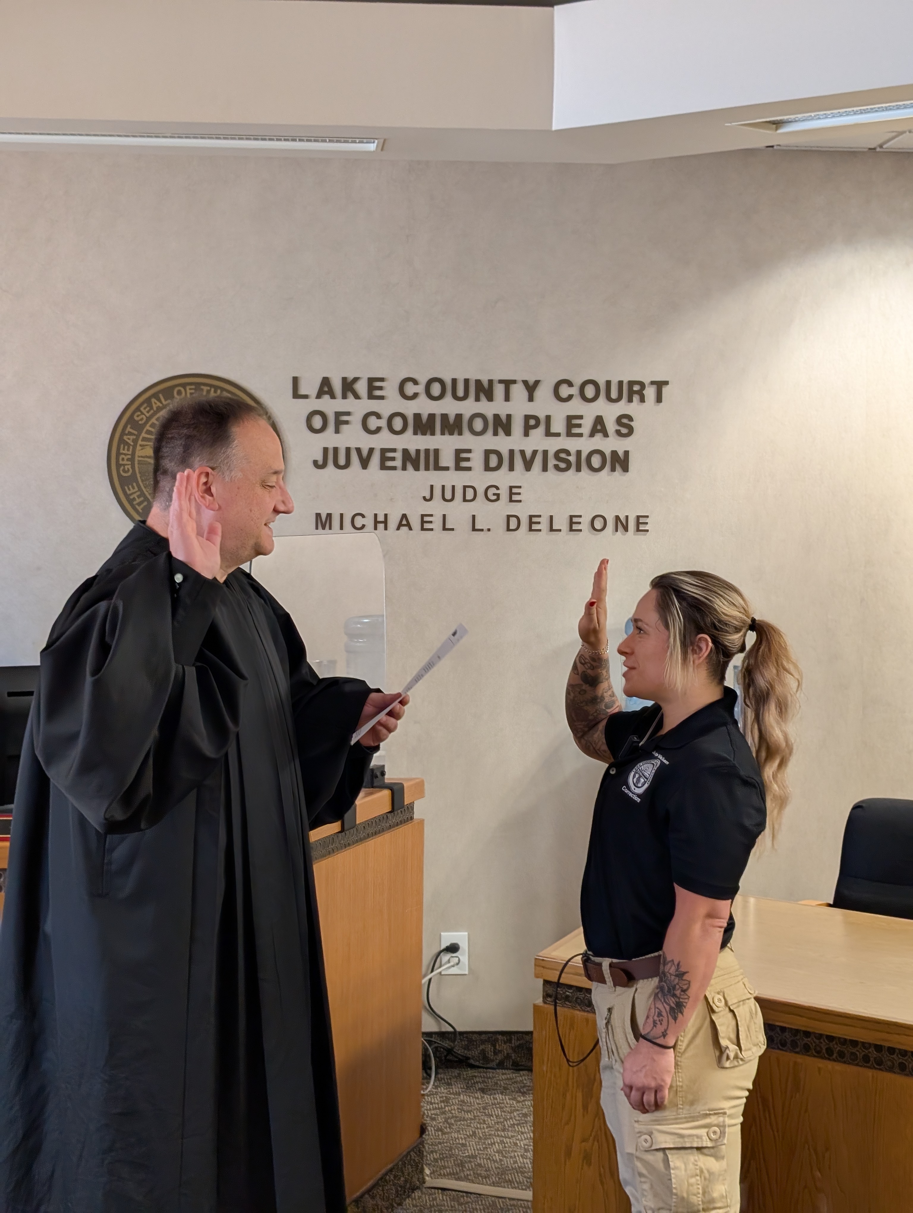 Judge DeLeone swearing in Natalie Pace as a Juvenile Corrections Officer.