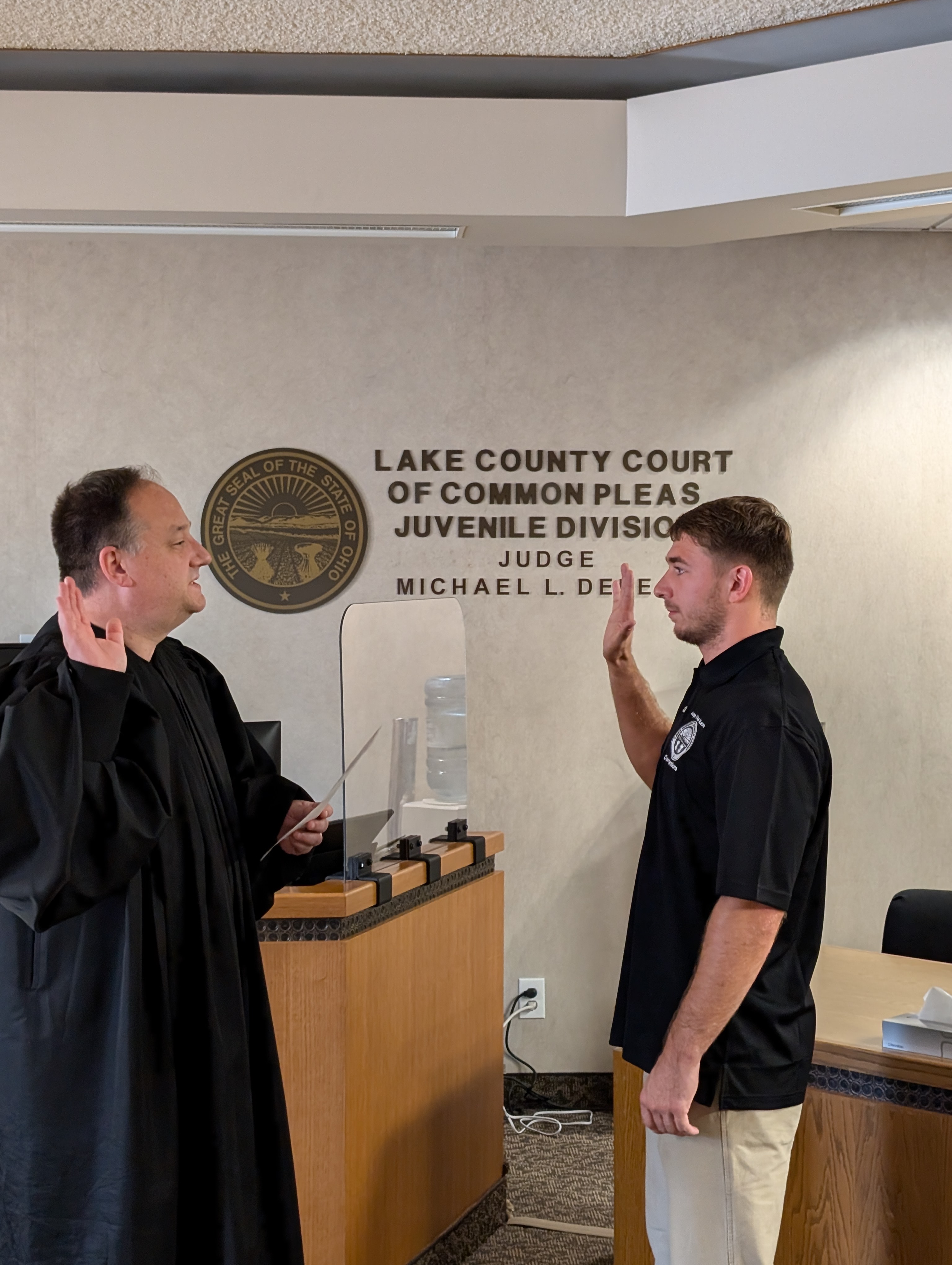 Judge DeLeone swearing in Vincent Scaramuzzino as a Juvenile Corrections Officer.