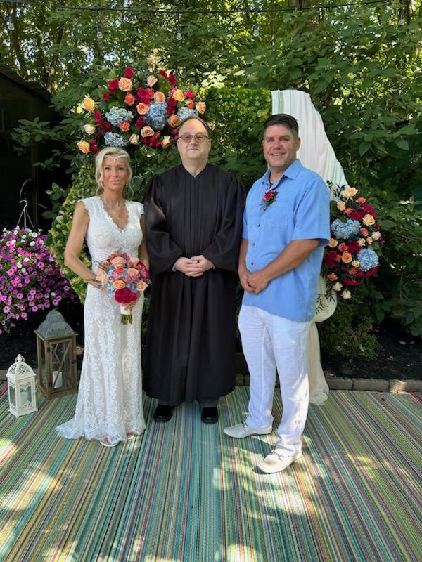 Congratulations to Albert Theodore Uber and Michele Mae Pennell on their beautiful wedding day, July 7,2024. Judge Michael L. DeLeone Officiating.