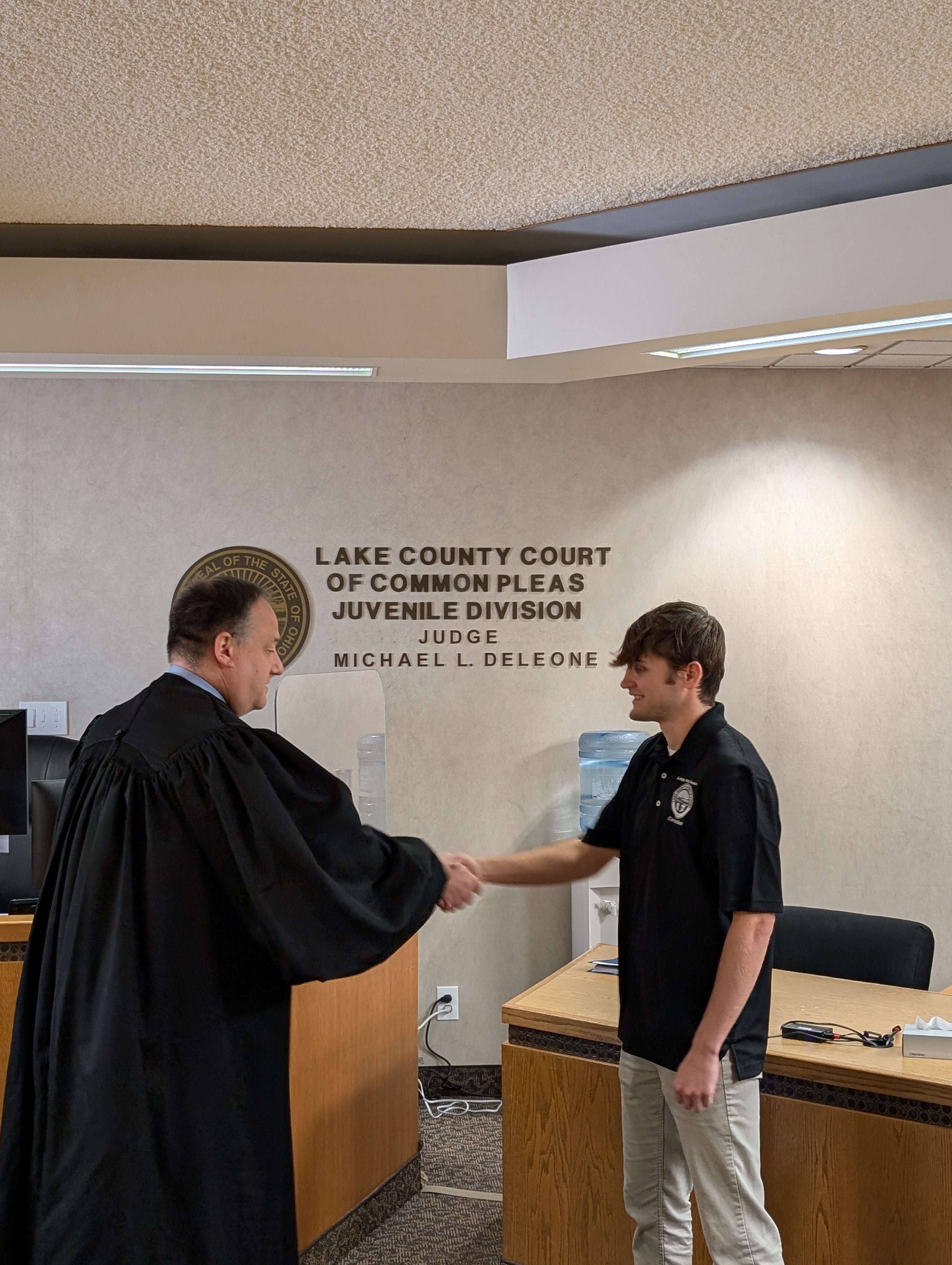 Judge DeLeone swearing in Brenden Hamilton as a Juvenile Corrections Officer.