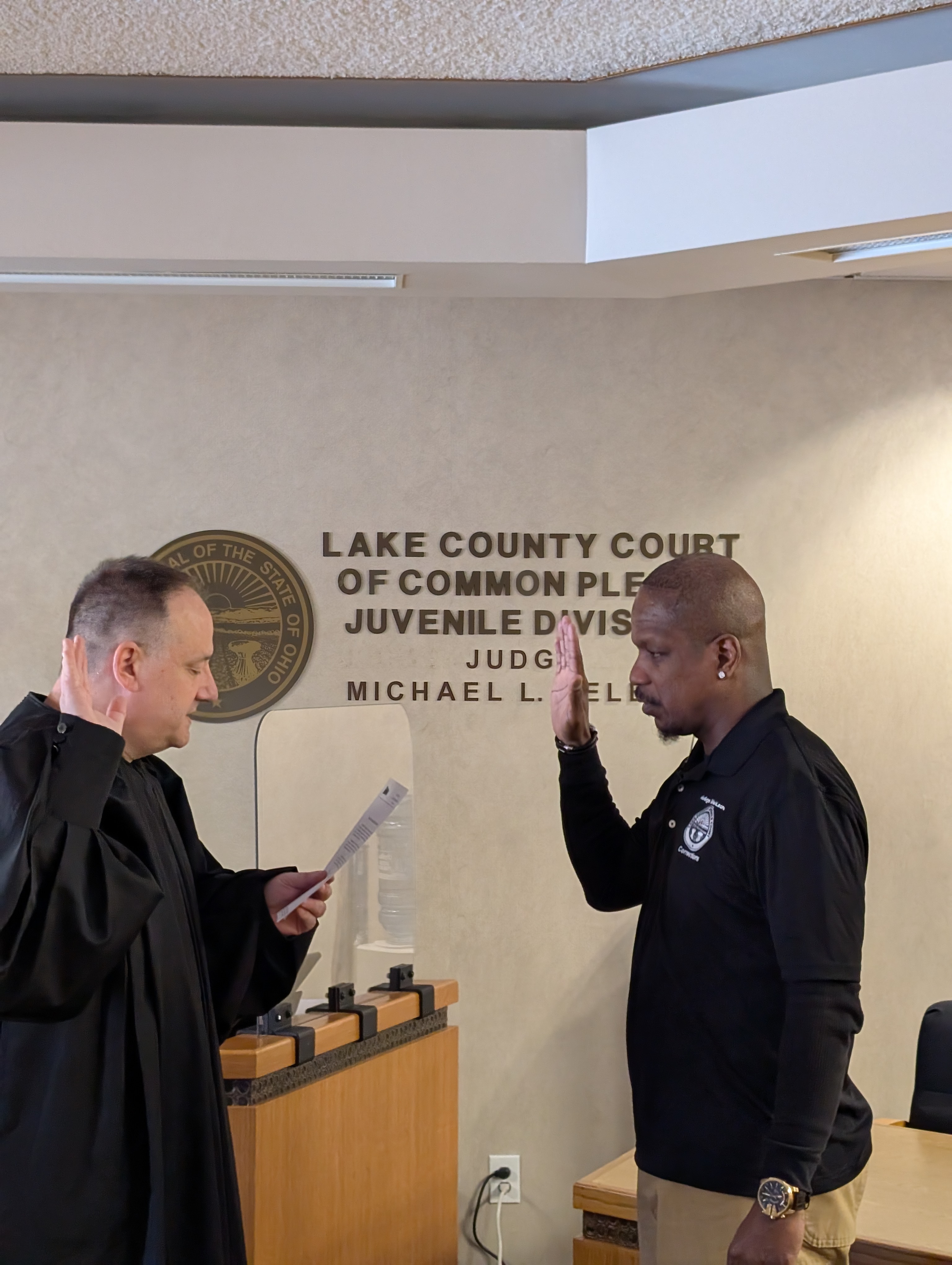 Judge DeLeone swearing in Ken Swindler as a Juvenile Corrections Officer