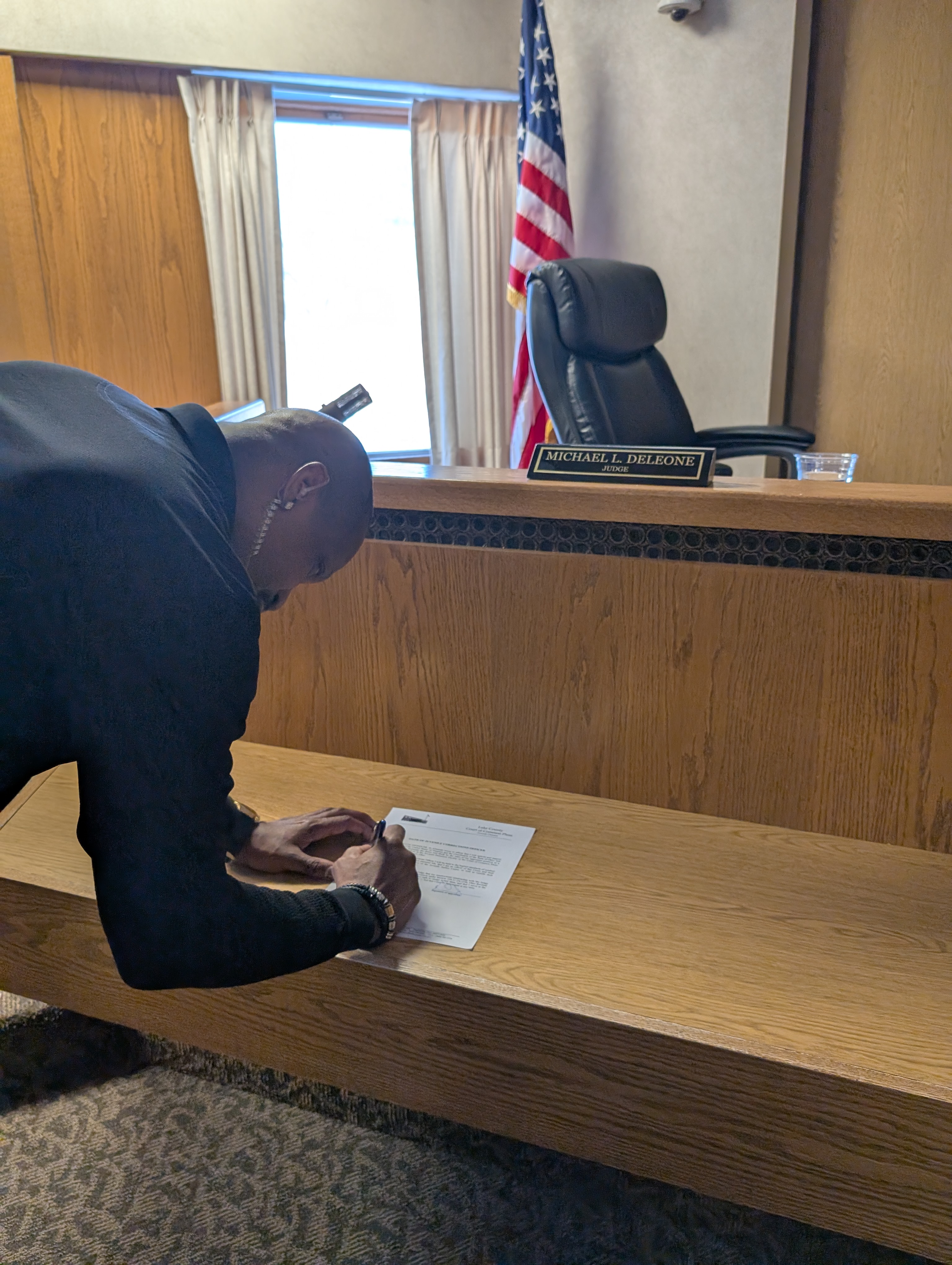 Judge DeLeone swearing in Ken Swindler as a Juvenile Corrections Officer